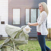 Lamb sound soother attached to stroller with mother pushing stroller