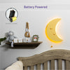 Battery powered with 9V battery - LumiDreams moon wall light lit up on wall in nursery.