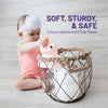 soft, sturdy, and safe - baby putting LumiUnicorn in basket.