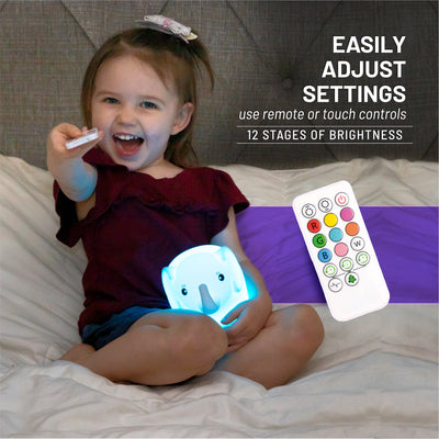 Easily adjust settings - 12 stages of brightness - girl with LumiElephant glowing blue with remote.