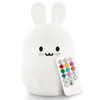 White bunny night light with a remote control on a white background