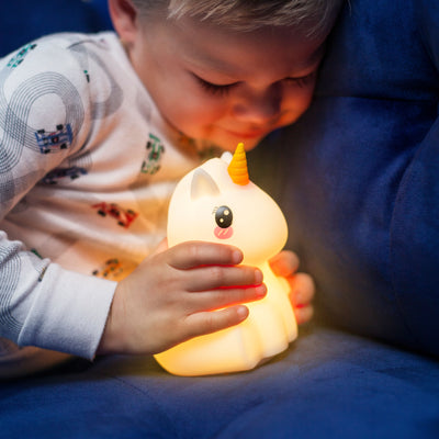 Child with unicorn LumiPet with Bluetooth.