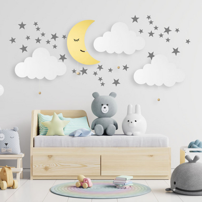 LumiDreams cloud and moon on the wall with stars in a child's bedroom.