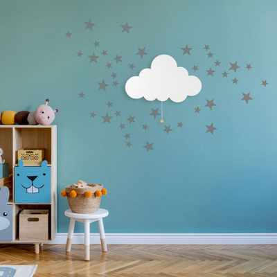 LumiDreams Cloud on a wall with star stickers in a play room.