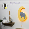 Battery powered with 9V battery - LumiDreams elephant on moon on the wall in nursery.