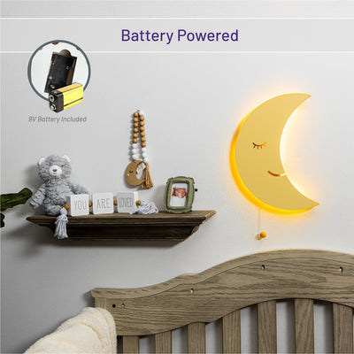 Battery powered with 9V battery - LumiDreams moon wall light lit up on wall in nursery.