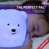 The perfect pal - Girl holding LumiBear nightlight glowing purple.