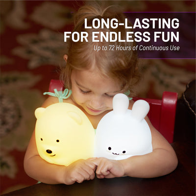 Long lasting for endless fun -  up to 72 hours of continuous use- girl holding glowing LumiBear and LumiBunny.