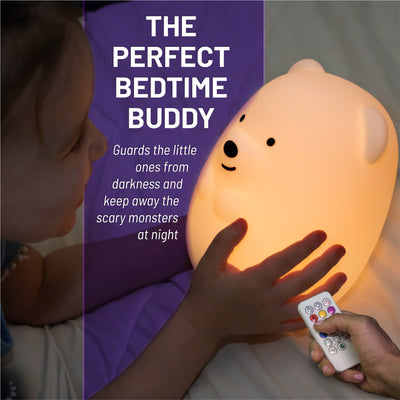The perfect bedtime buddy - girl holding glowing LumiBear with remote.