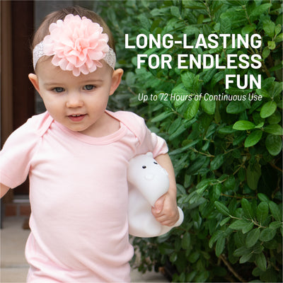Long lasting for endless fun - up to 72 hours of continuous use - Girl holding LumiHippo nightlight.